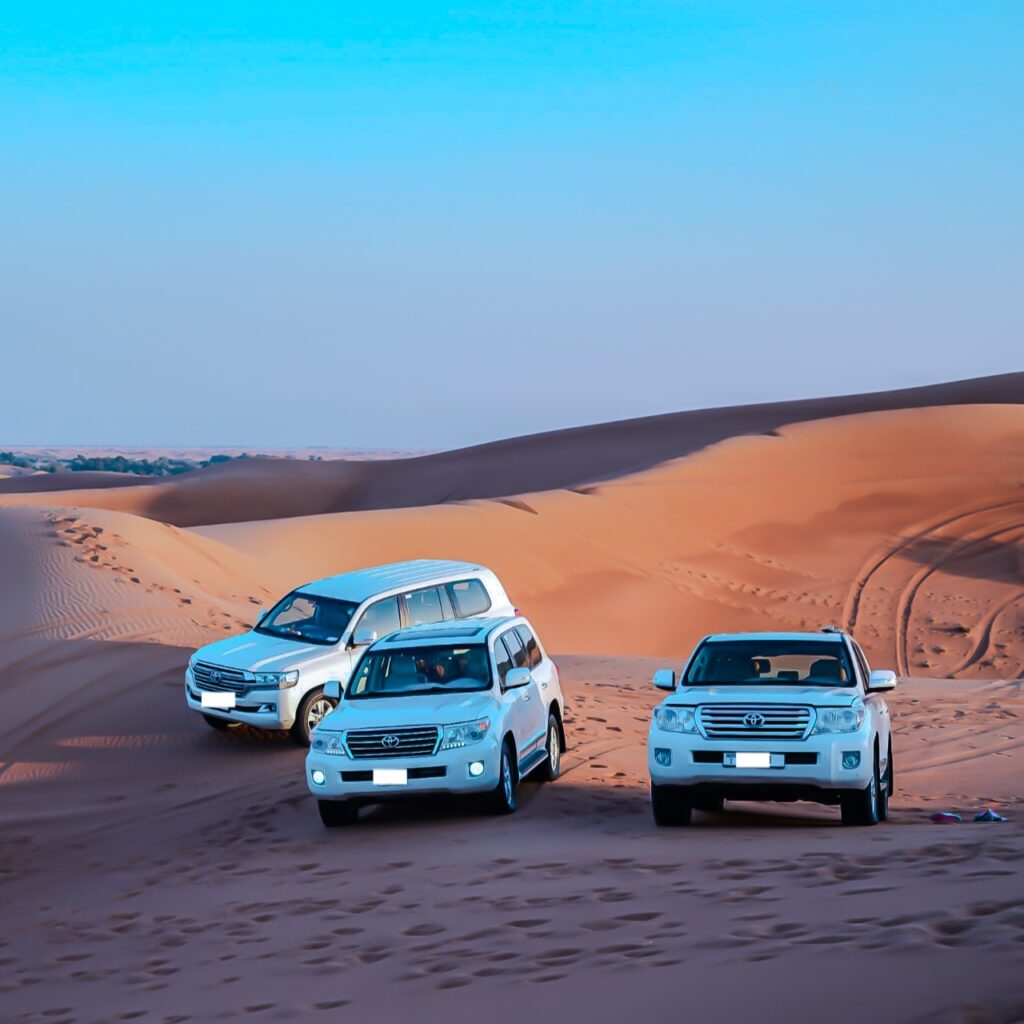 cars parked in the sand